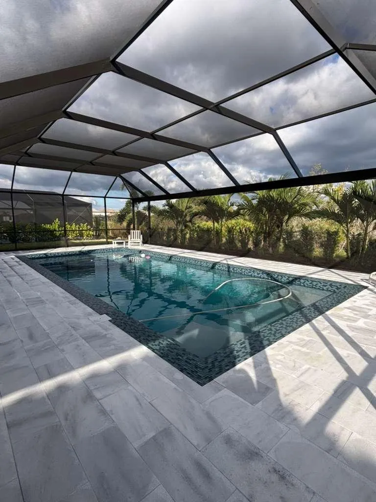 Luxury custom swimming pool construction with infinity edge and modern design